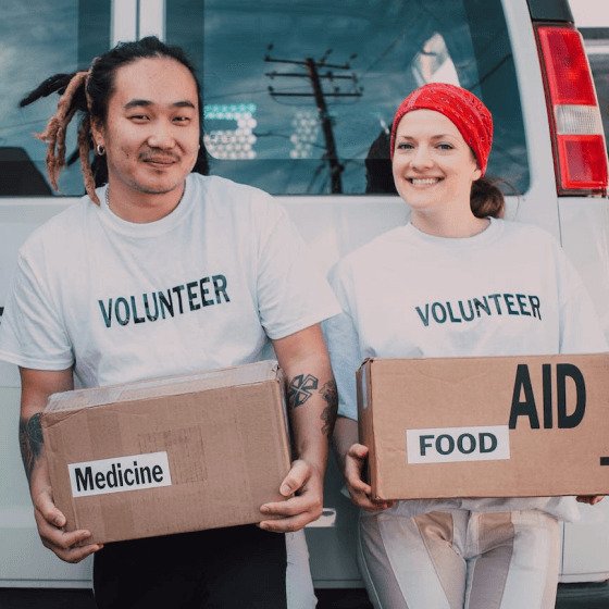 Volunteers distributing free medicines to needy patients in a charity health camp